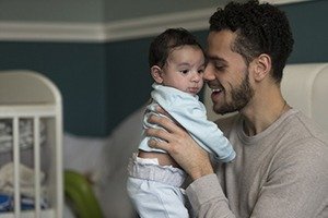 A father in Denver who is happy with his child.